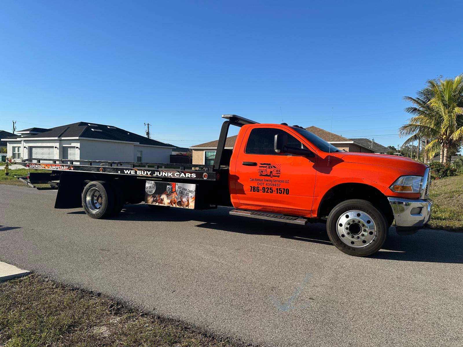 San Roman Towing Services flatbed tow truck